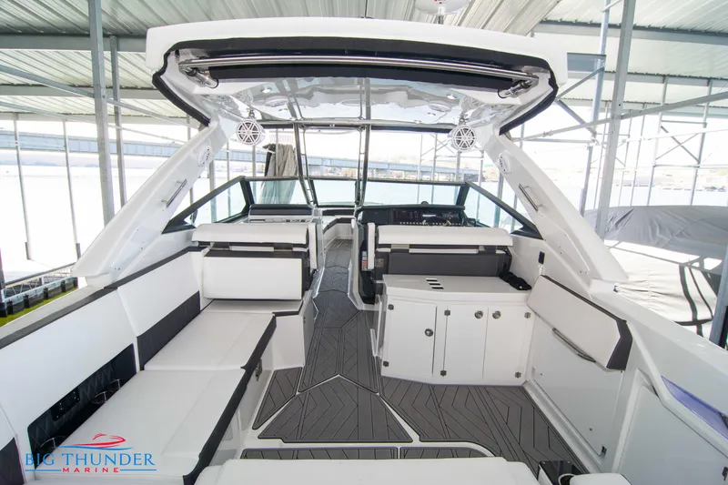 Slide: The Image of 2022 Monterey 378 SS boat interior with modern seating and dashboard. - 16