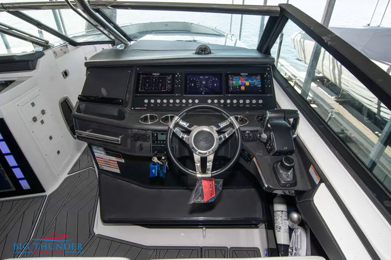 Slide: The Image of 2022 Monterey 378 SS boat helm with advanced navigation controls and modern dashboard. - 32