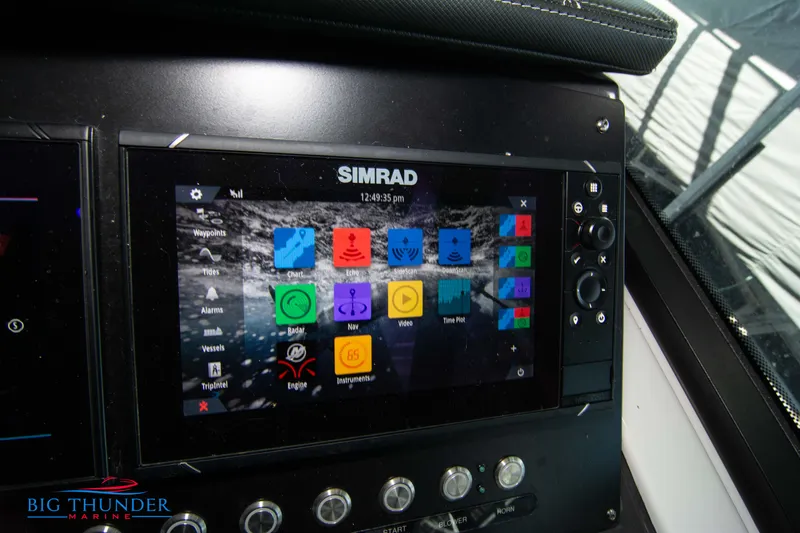 Slide: The Image of 2022 Monterey 378 SS boat dashboard with Simrad navigation system. - 35