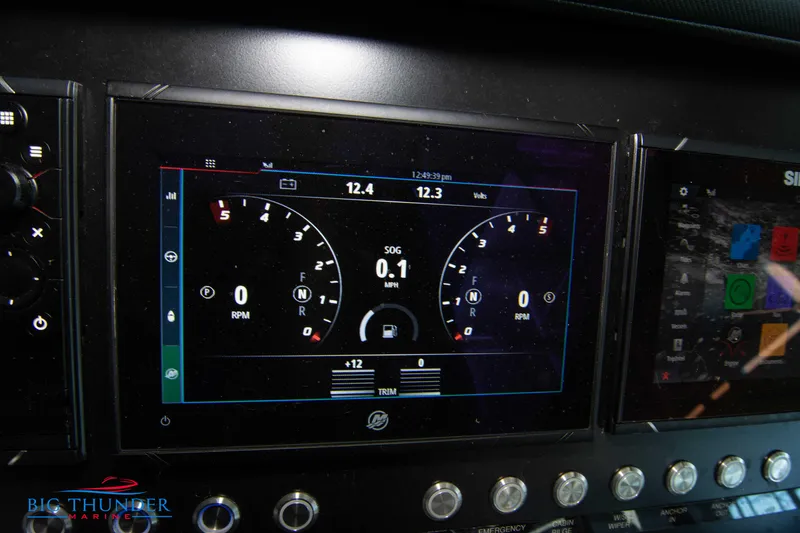 Slide: The Image of Dashboard display of a 2022 Monterey 378 SS boat showing RPM and speed gauges. - 36