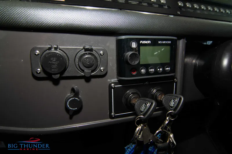 Slide: The Image of Control panel of a 2022 Monterey 378 SS boat with keys and Fusion MS-RA200 radio. - 42