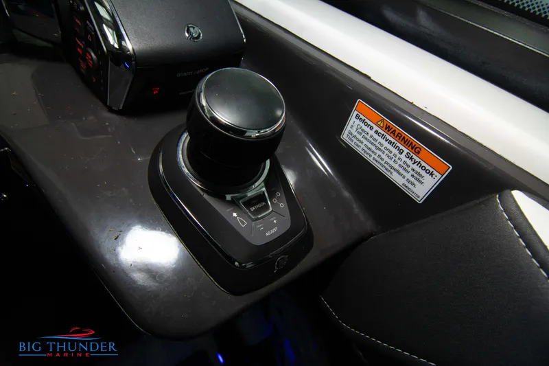 Slide: The Image of 2022 Monterey 378 SS boat control panel with joystick and warning label. - 45