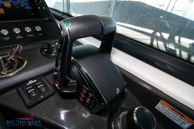 Slide: The Image of 2022 Monterey 378 SS boat throttle controls and dashboard. - 46