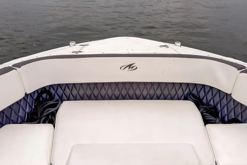 Slide: The Image of 2022 Monterey 378SS Super Sport boat interior with cushioned seating and water view. - 25