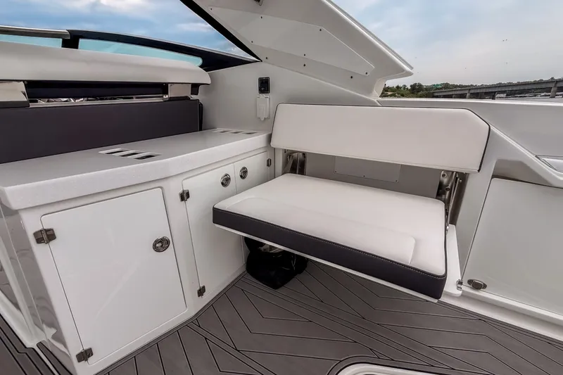 Slide: The Image of Interior of 2022 Monterey 378SS Super Sport boat with white seating and cabinetry. - 39