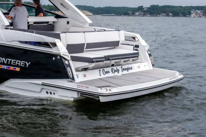 Slide: The Image of 2022 Monterey 378SS Super Sport boat on water, rear view with seating area. - 10