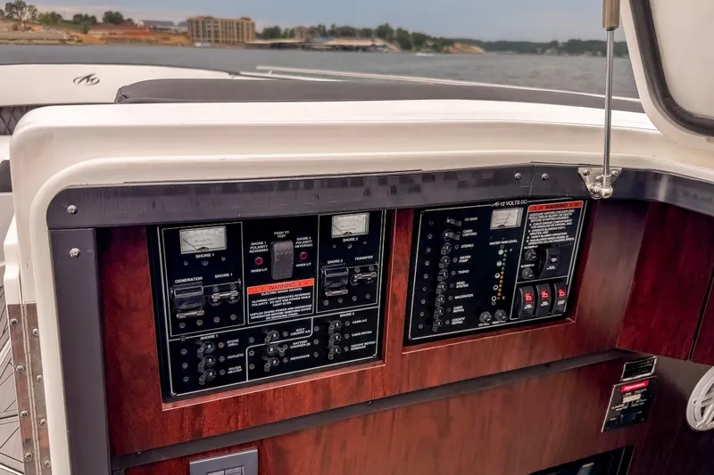 Slide: The Image of Control panel of a 2022 Monterey 378SS Super Sport boat, featuring various switches and gauges. - 28
