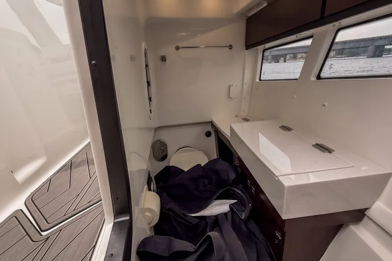 Slide: The Image of Interior cabin of 2022 Monterey 378SS Super Sport boat with windows and storage. - 33