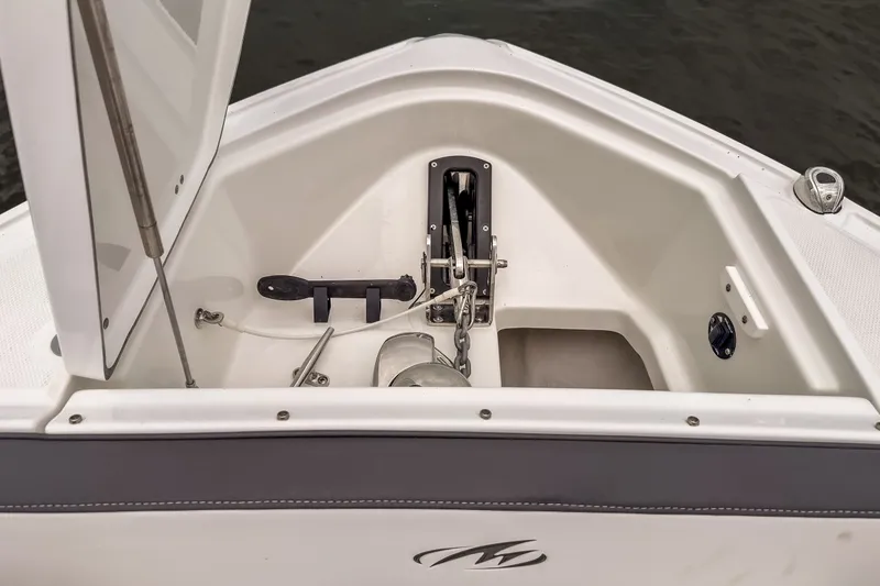 Slide: The Image of 2022 Monterey 378SS Super Sport boat anchor compartment with open hatch and chain. - 26