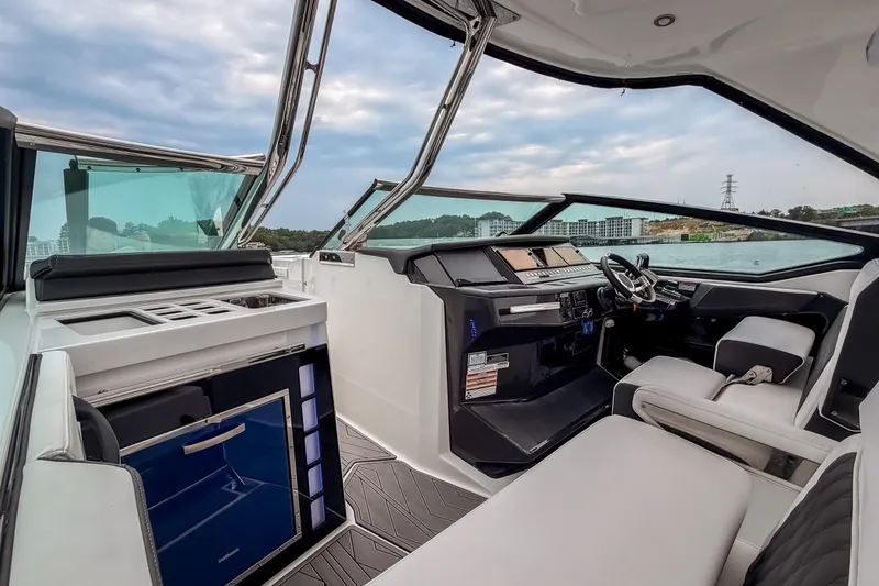 Slide: The Image of Interior of 2022 Monterey 378SS Super Sport boat with modern helm and seating. - 16