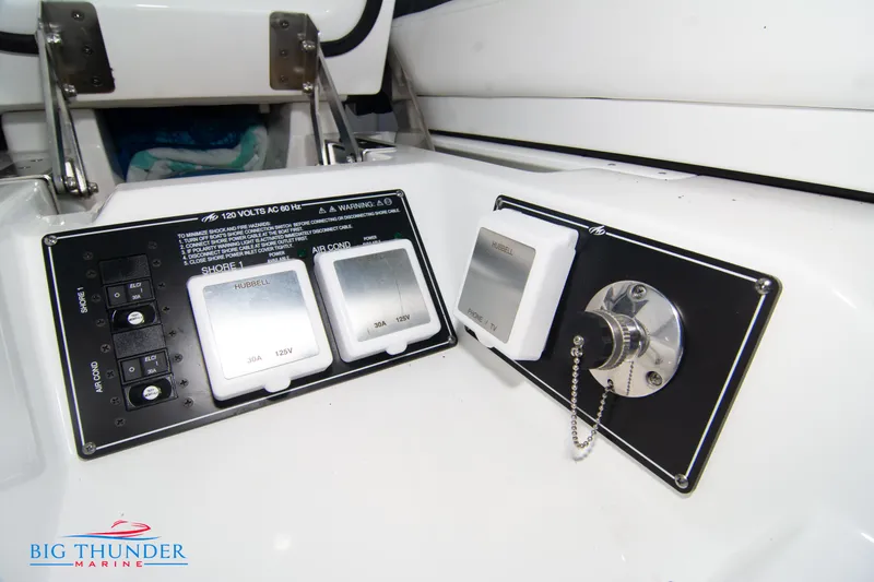 Slide: The Image of Control panel and electrical outlets on a 2022 Monterey 378 SS boat by Big Thunder Marine. - 14