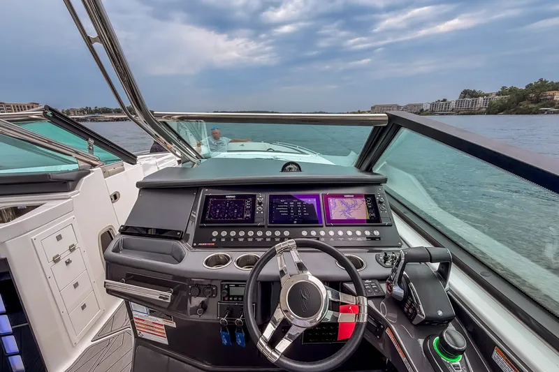 Slide: The Image of Cockpit view of 2022 Monterey 378SS Super Sport boat with advanced navigation system. - 12