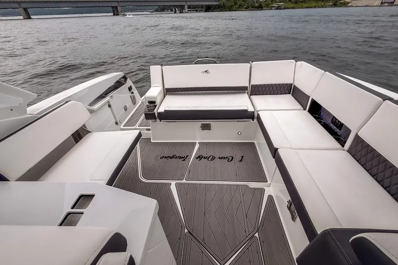 Slide: The Image of Luxurious seating area on a 2022 Monterey 378SS Super Sport boat, overlooking the water. - 21