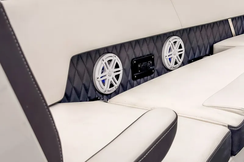 Slide: The Image of Luxurious seating with speakers in 2022 Monterey 378SS Super Sport boat interior. - 24