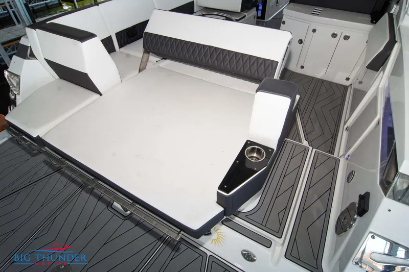 Slide: The Image of 2022 Monterey 378 SS boat interior with cushioned seating and cup holder. - 10