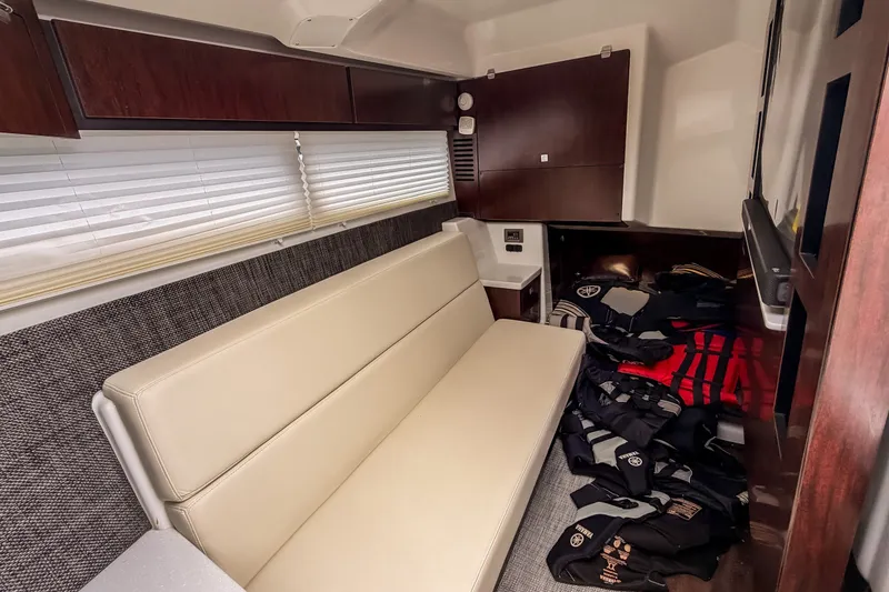 Slide: The Image of Interior of 2022 Monterey 378SS Super Sport boat with beige seating and life jackets. - 30