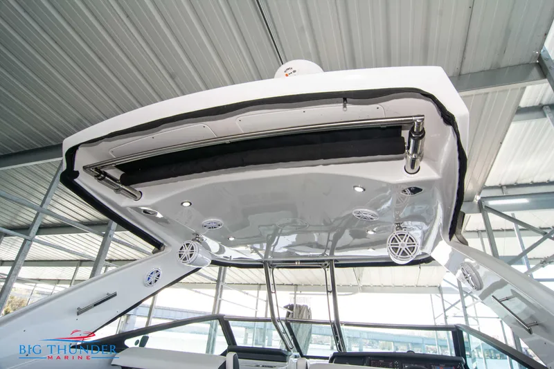 Slide: The Image of 2022 Monterey 378 SS boat under a covered dock. - 27