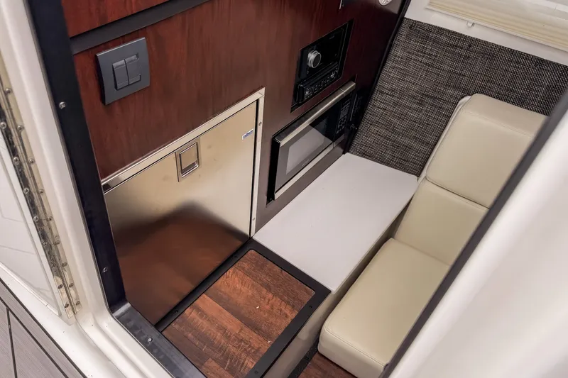 Slide: The Image of Interior of 2022 Monterey 378SS Super Sport boat with seating and kitchenette. - 29