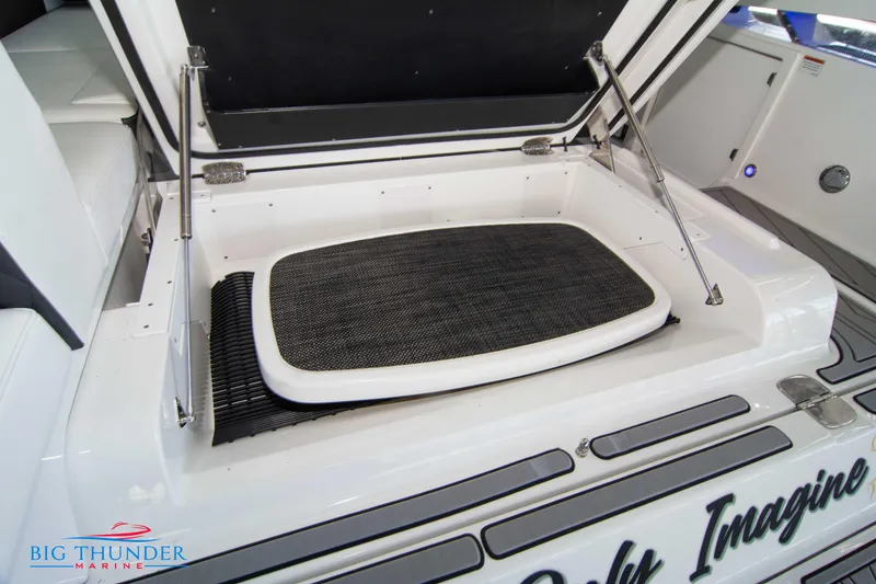 Slide: The Image of 2022 Monterey 378 SS boat storage compartment with open lid. - 12