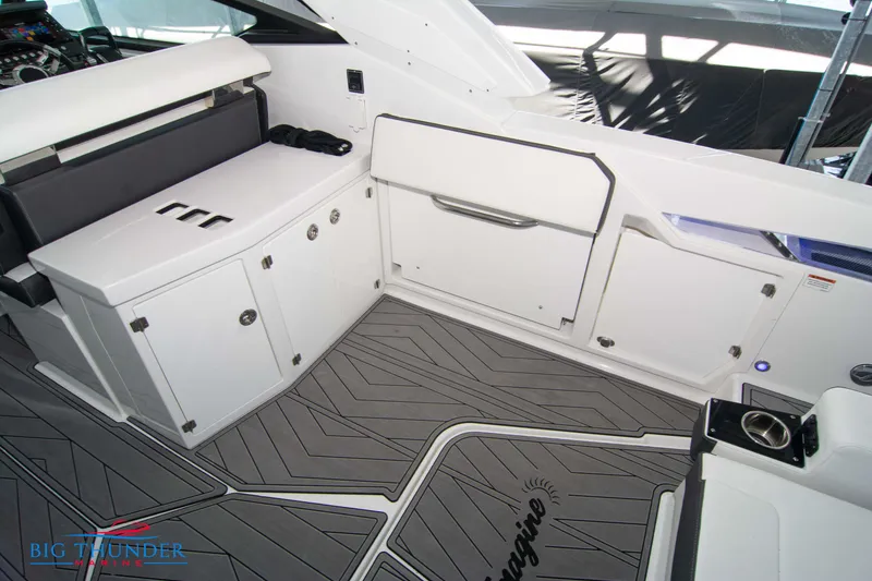 Slide: The Image of 2022 Monterey 378 SS boat interior with seating and storage compartments. - 21