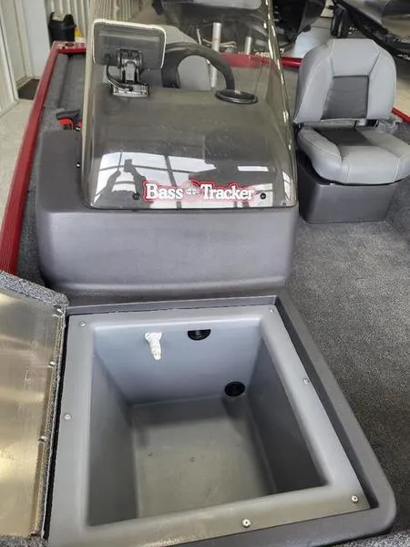 Slide: The Image of 2024 Tracker CLASSIC XL boat interior with storage compartment and seating. - 2