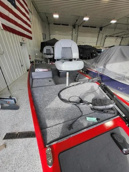 Slide: The Image of 2024 Tracker CLASSIC XL fishing boat in a garage. - 7