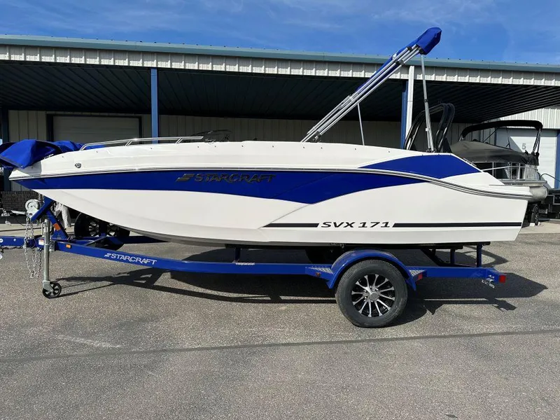 The Image of 2024 Starcraft SVX 171 OB boat on a blue trailer. - 0