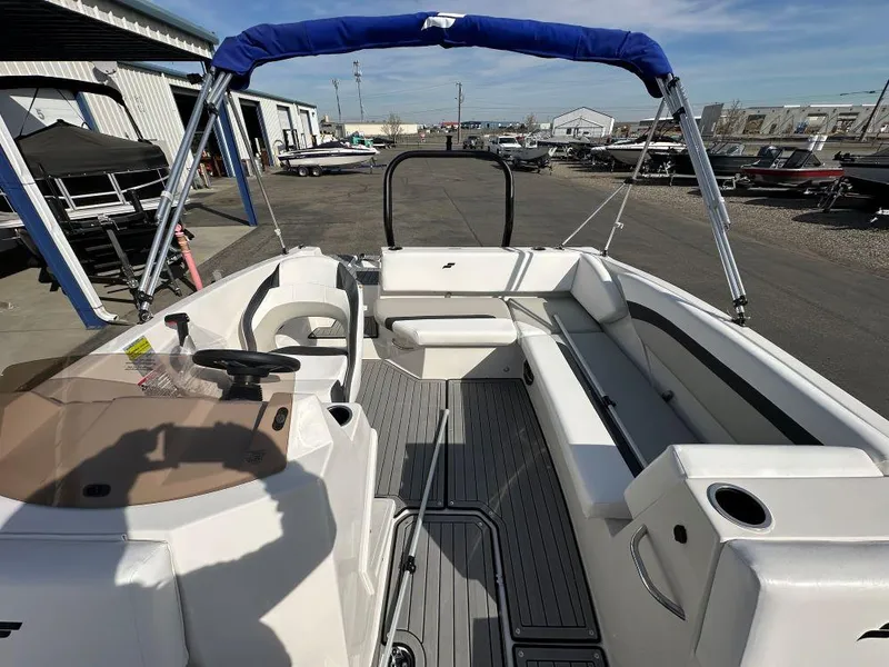 Slide: The Image of 2024 Starcraft SVX 171 OB boat interior with seating and steering console. - 3