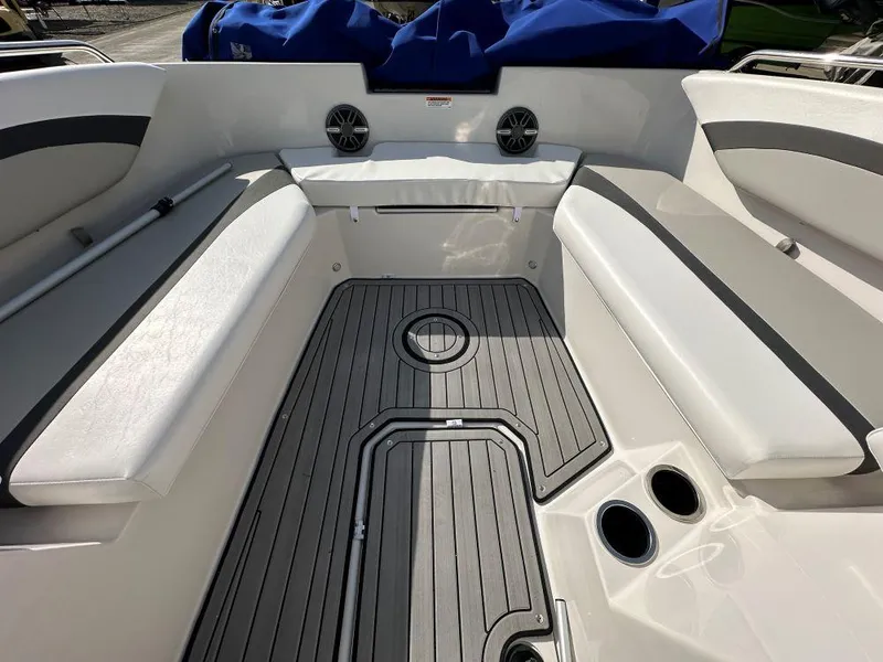 Slide: The Image of 2024 Starcraft SVX 171 OB boat interior with cushioned seating and cup holders. - 5