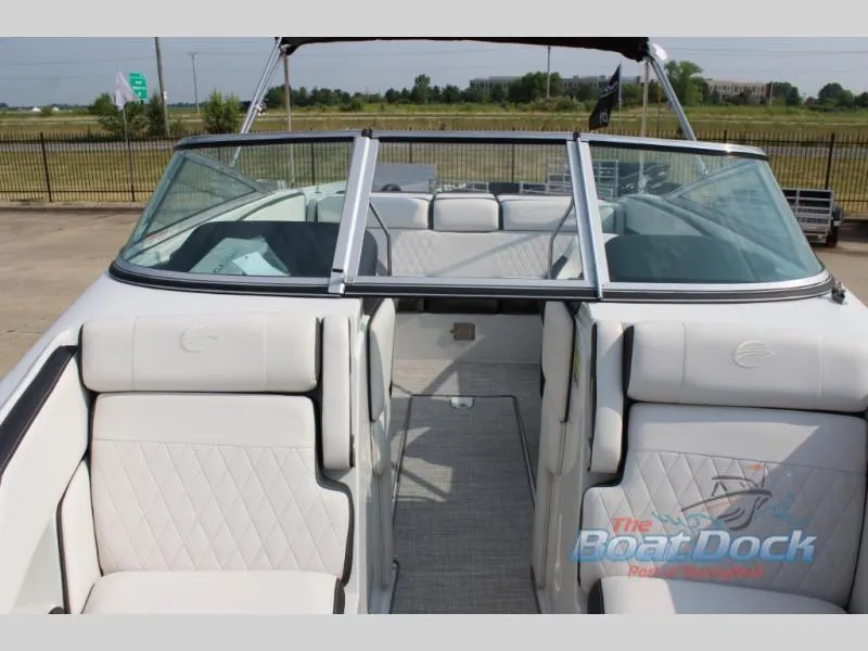 Slide: The Image of 2023 Crownline 240 SS boat interior with white seating and open windshield. - 6