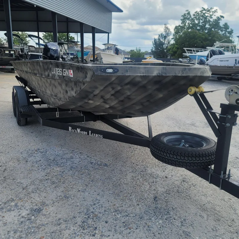 Slide: The Image of 2021 WeldBilt 2170 boat on a trailer at a marina. - 4