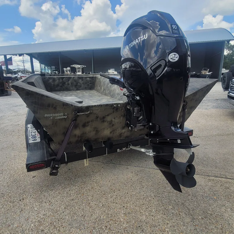 Slide: The Image of 2021 WeldBilt 2170 boat with Tohatsu outboard motor on trailer. - 5