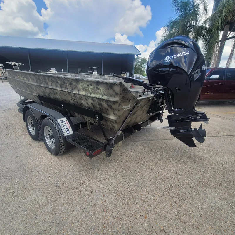Slide: The Image of 2021 WeldBilt 2170 boat on trailer with Tohatsu outboard motor. - 6