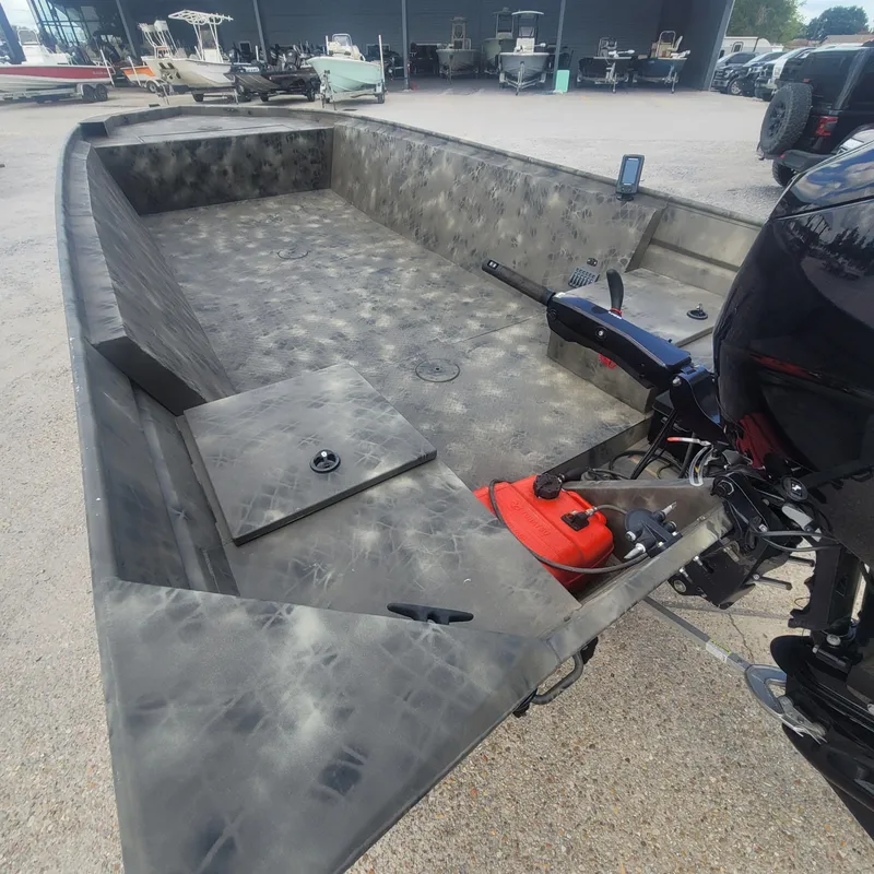 Slide: The Image of 2021 WeldBilt 2170 aluminum boat with outboard motor and spacious interior. - 7