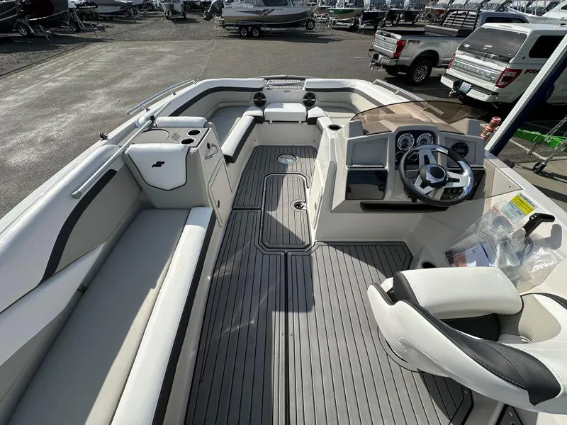 Slide: The Image of 2024 Starcraft SVX 191 OB boat interior with seating and steering console. - 5