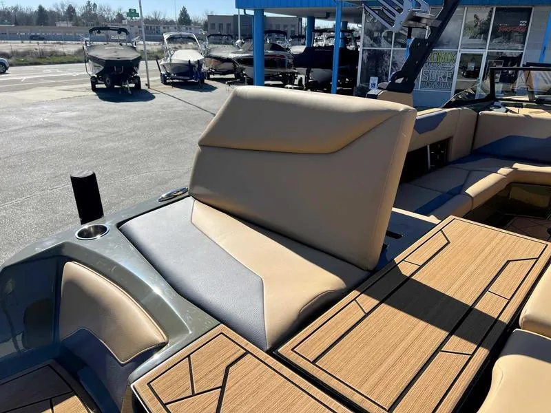Slide: The Image of 2024 ATX Surf Boats 24 Type-S interior seating and deck view. - 10