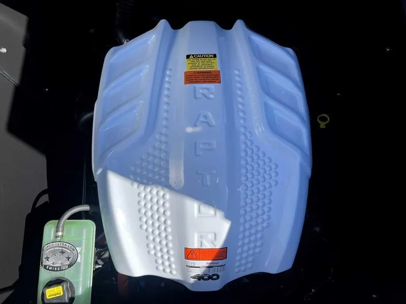 Slide: The Image of 2024 ATX Surf Boats 24 Type-S engine with Raptor branding. - 13