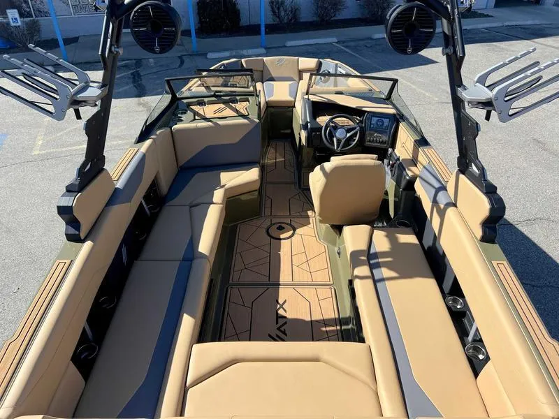 Slide: The Image of 2024 ATX Surf Boats 24 Type-S interior with tan and black seating, advanced dashboard. - 14