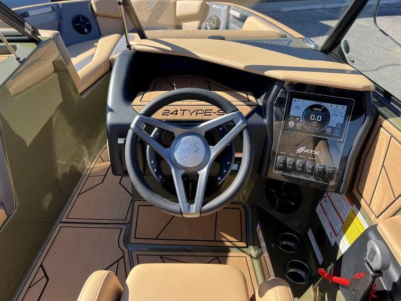 Slide: The Image of 2024 ATX Surf Boats 24 Type-S dashboard and steering wheel. - 3
