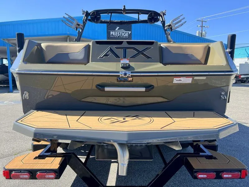 Slide: The Image of 2024 ATX Surf Boats 24 Type-S rear view at dealership. - 4