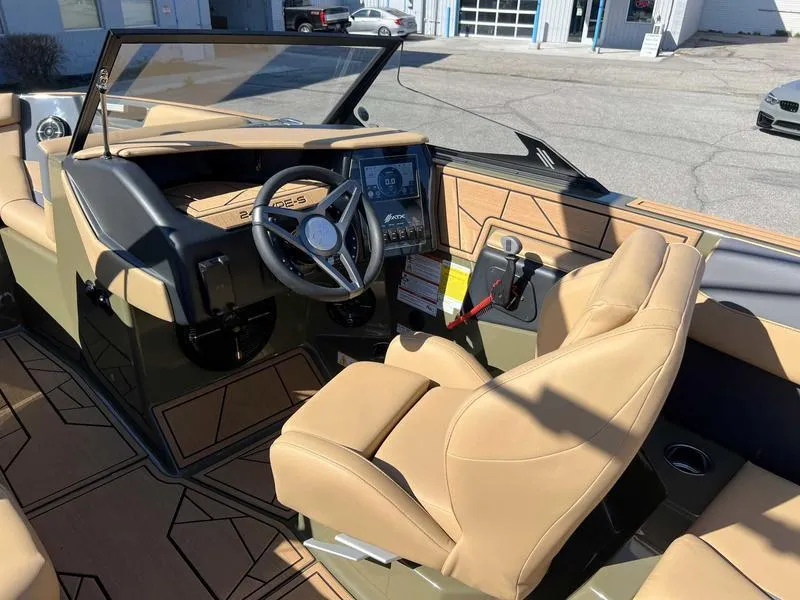 Slide: The Image of 2024 ATX Surf Boats 24 Type-S interior with tan seats and modern dashboard. - 5