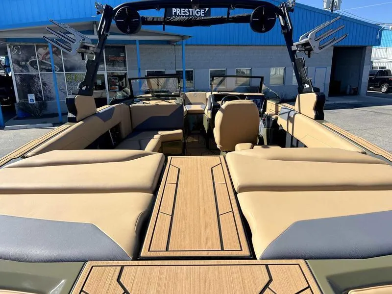 Slide: The Image of 2024 ATX Surf Boats 24 Type-S interior with tan and gray seating, Prestige wakeboard tower. - 7