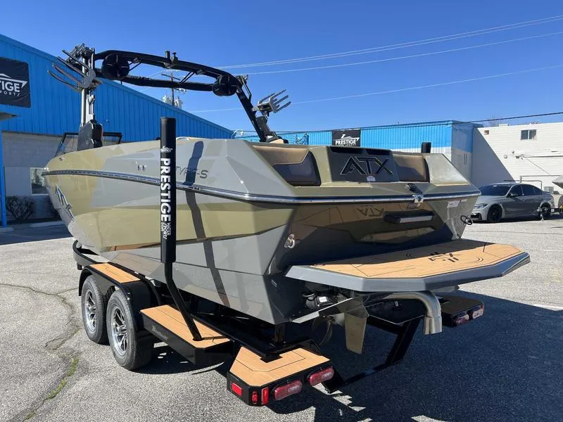 Slide: The Image of 2024 ATX Surf Boats 24 Type-S on a trailer in a parking lot. - 9
