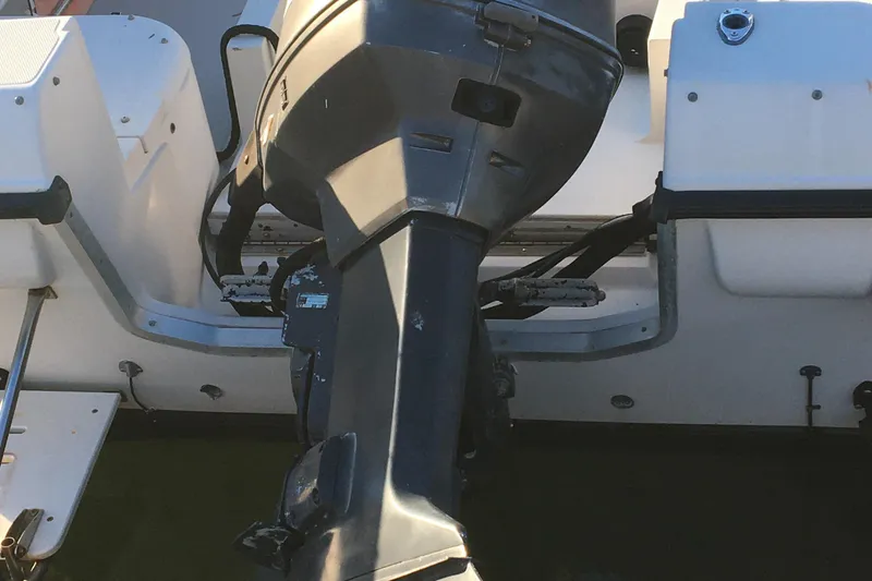 Slide: The Image of Outboard motor on a 1998 Stratos 2100 boat. - 12