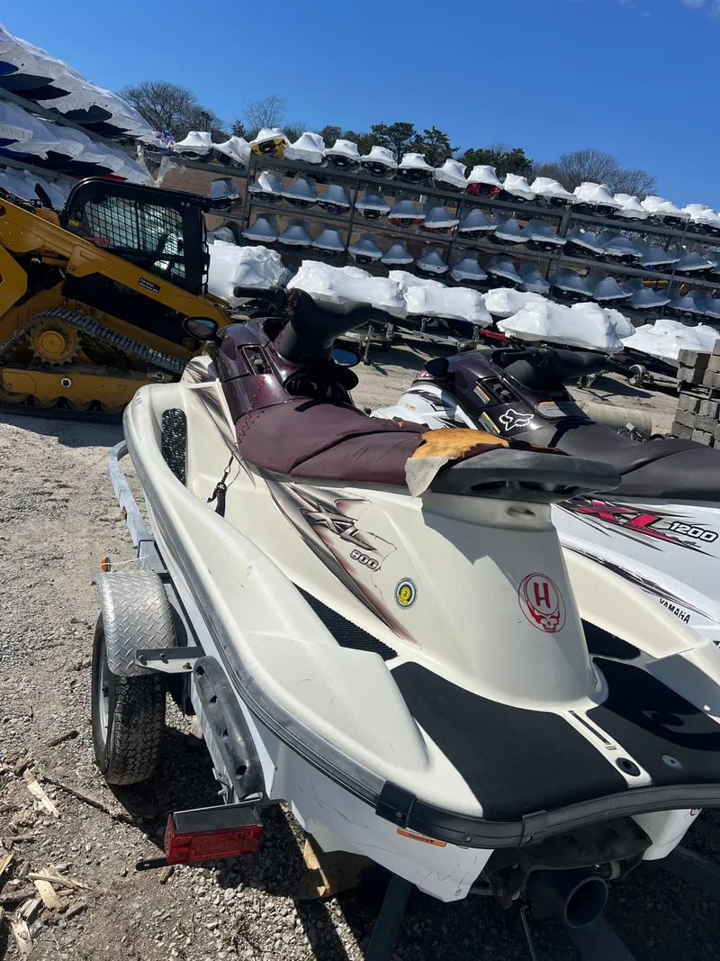 Slide: The Image of 2000 Yamaha WaveRunner XL 800 jet ski on a trailer in a storage yard. - 3