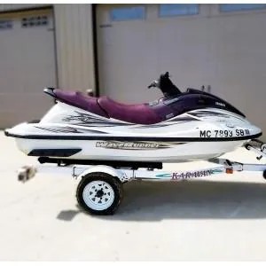 Slide: The Image of 2000 Yamaha WaveRunner XL 800 on trailer, parked outside a garage. - 8