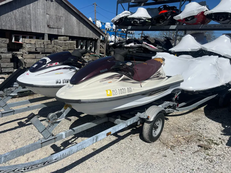 Slide: The Image of 2000 Yamaha WaveRunner XL 800 on trailer, parked outdoors with other jet skis. - 9