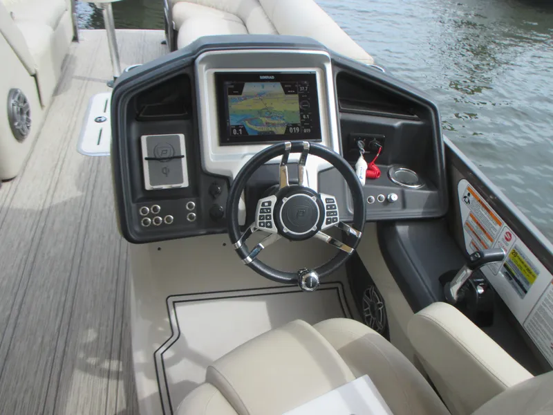 Slide: The Image of 2018 Premier 270 Intrigue RF boat dashboard with steering wheel and navigation system. - 12