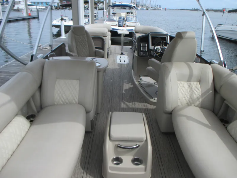 Slide: The Image of 2018 Premier 270 Intrigue RF pontoon boat interior with luxurious seating and modern dashboard. - 15