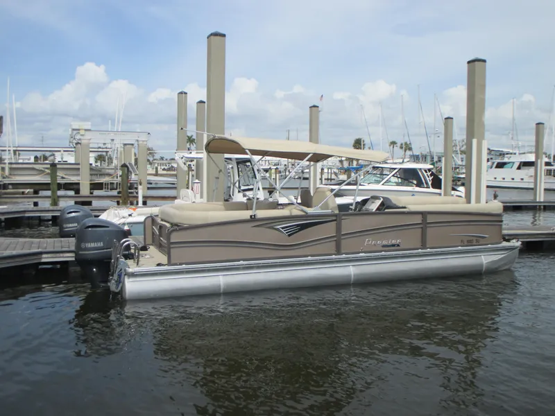 Slide: The Image of 2018 Premier 270 Intrigue RF pontoon boat docked at marina. - 2